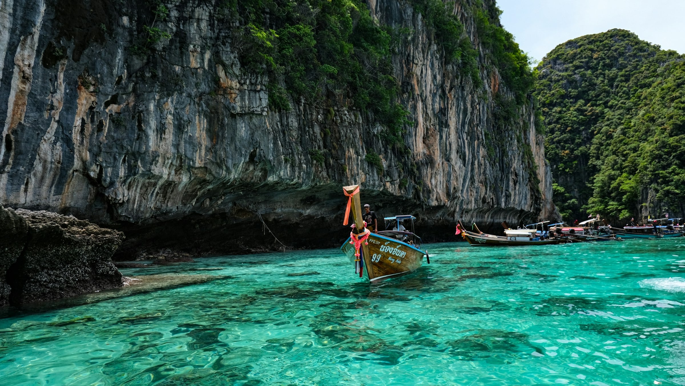 A longtail boat in the turquoise water of the Phi Phi Islands