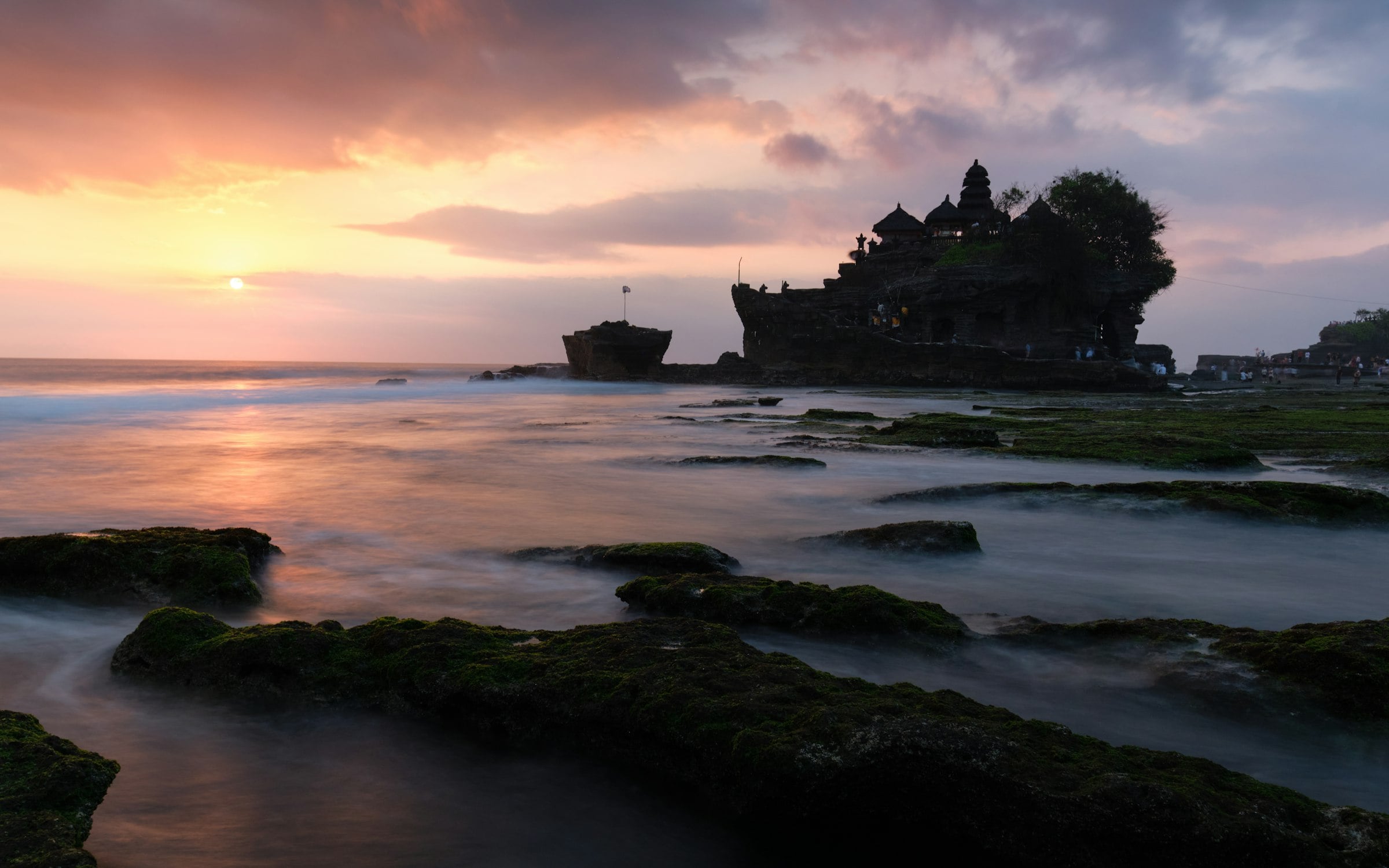 Tanah Lot temple on its rock in the sea at sunset, Bali