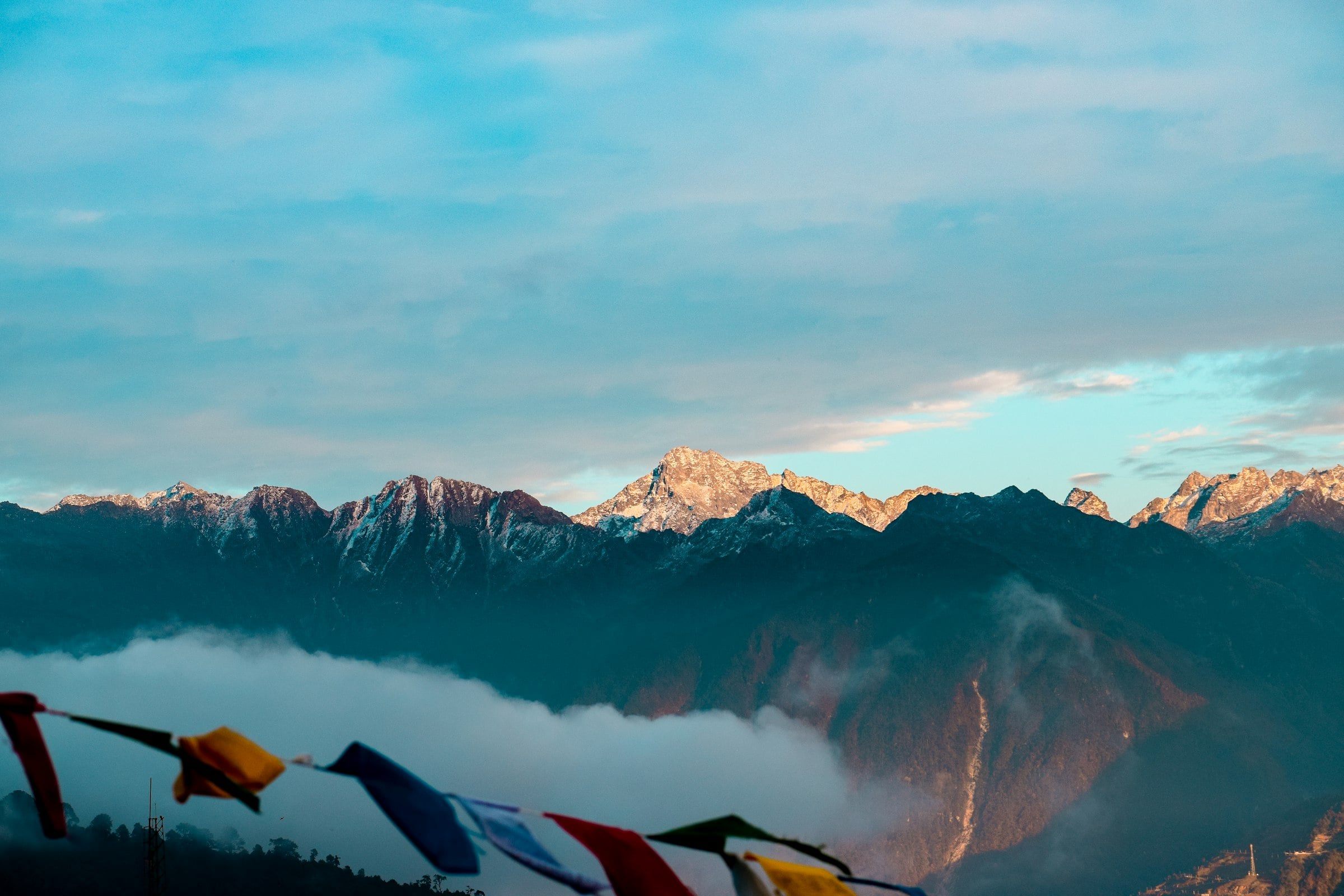Sunlit Himalayan peaks above the clouds in Arunachal Pradesh